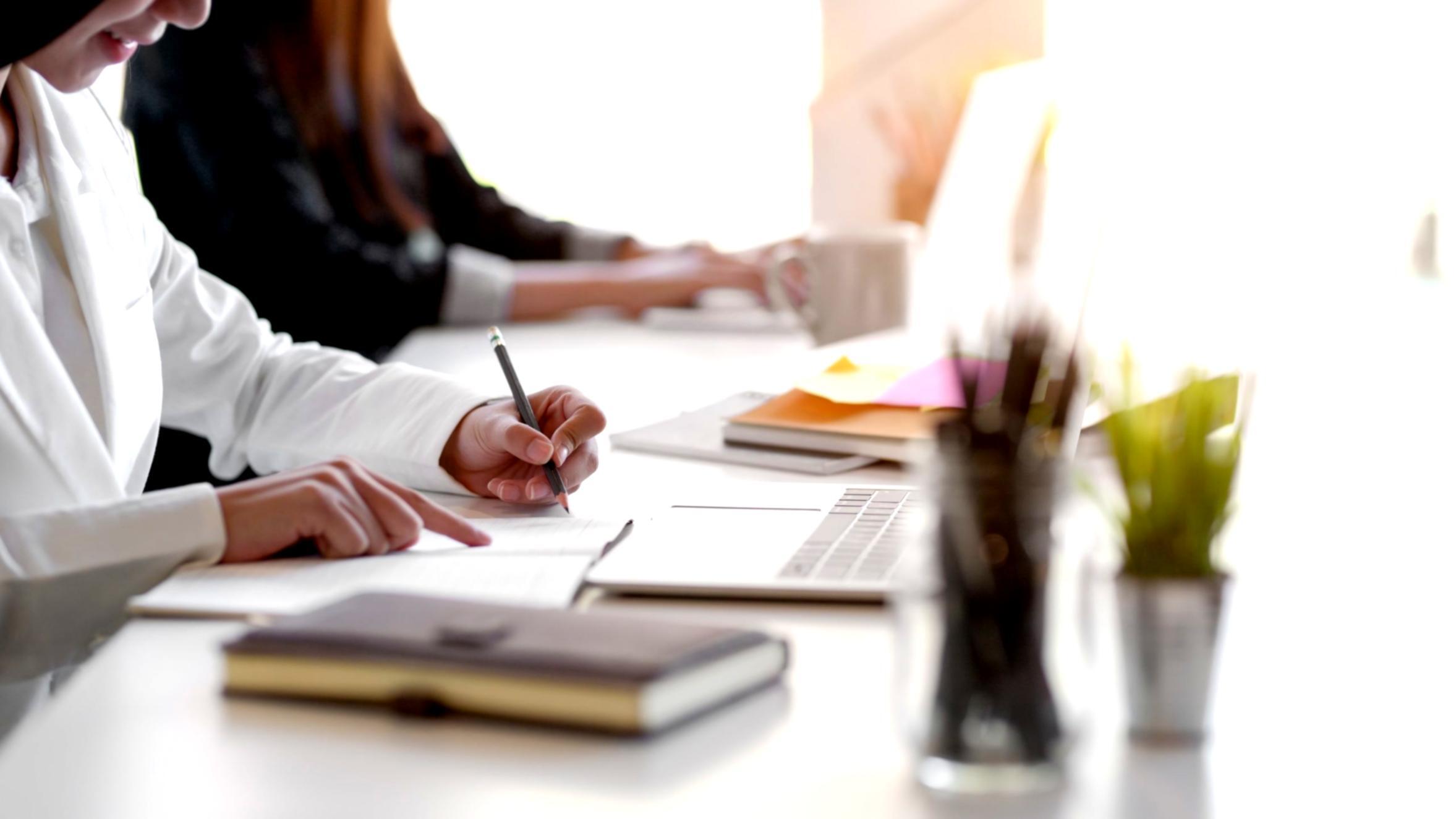 Journalism classroom with students engaged in discussion